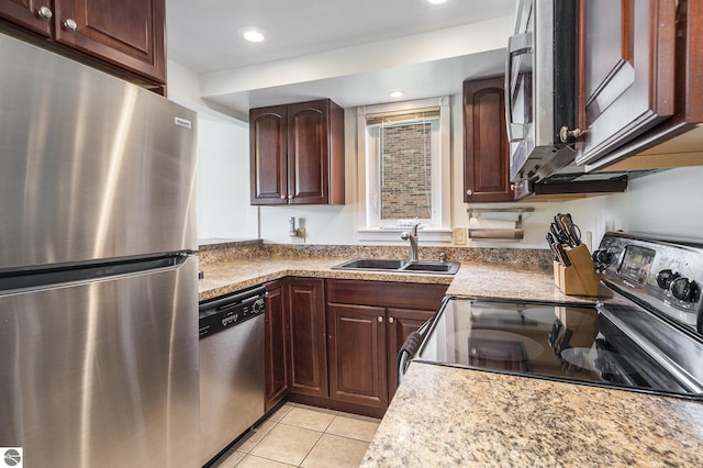 6022 Holt Rd Unit 2, Williamsburg, MI 49690 - kitchen featuring appliances with stainless steel finishes, light tile patterned floors, and recessed lighting