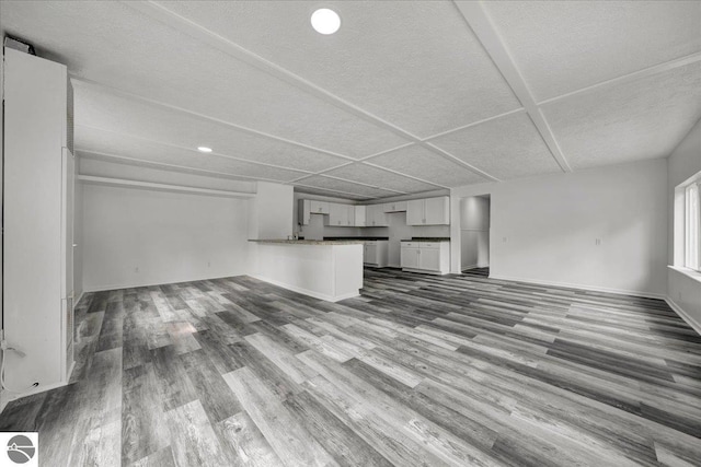 3594 Channel Rd, Hale, MI 48739 - unfurnished living room with wood finished floors and recessed lighting