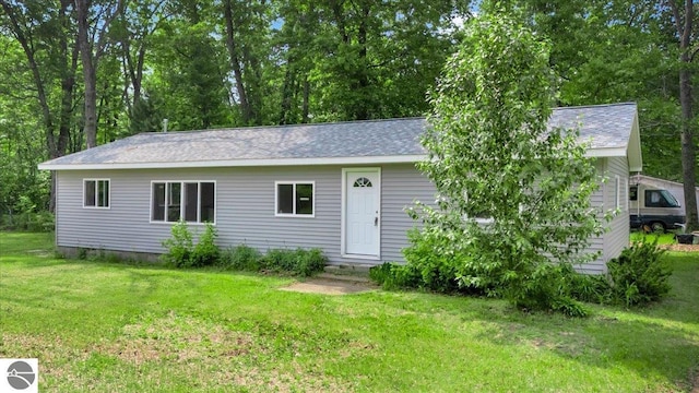 3594 Channel Rd, Hale, MI 48739 - view of front of house with a front lawn, roof with shingles, and entry steps