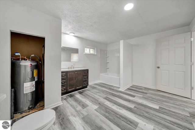 3594 Channel Rd, Hale, MI 48739 - below grade area with water heater, light wood finished floors, and a textured ceiling