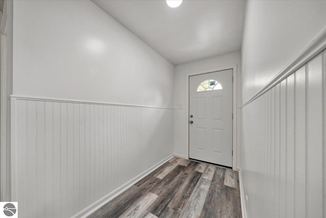 3594 Channel Rd, Hale, MI 48739 - doorway featuring wood finished floors and wainscoting