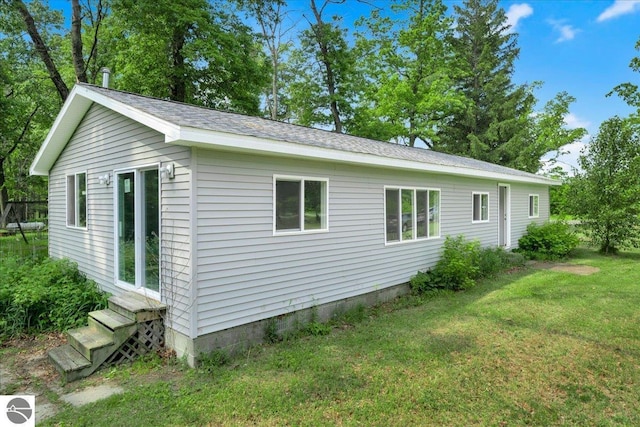 3594 Channel Rd, Hale, MI 48739 - view of side of home with a yard