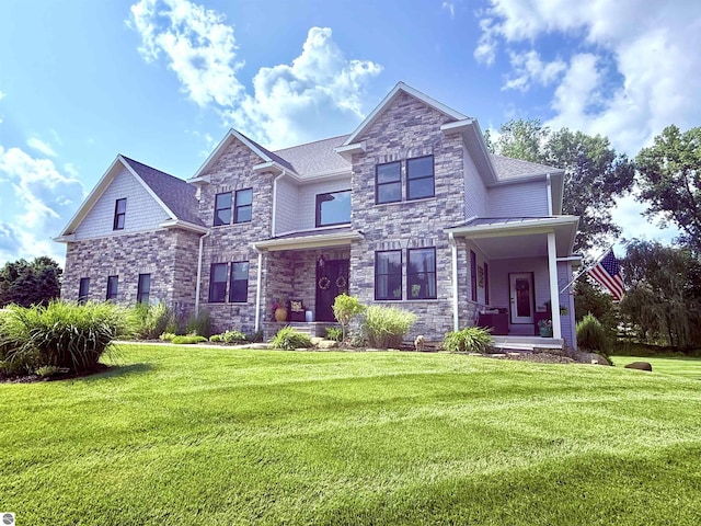 777 Stoneridge Dr, Mount Pleasant, MI 48858 - view of front facade featuring stone siding and a front lawn