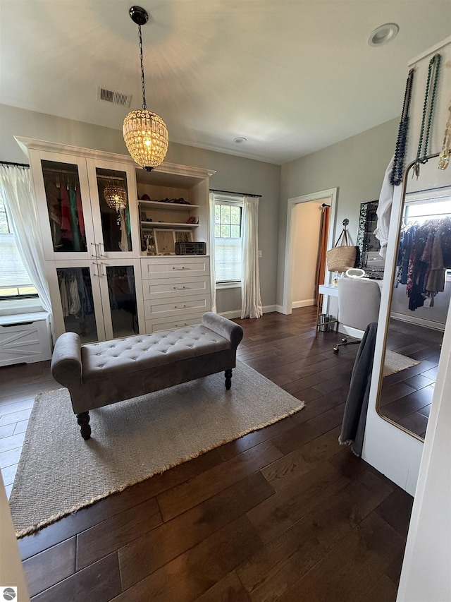 777 Stoneridge Dr, Mount Pleasant, MI 48858 - bedroom featuring dark wood-style floors and a chandelier