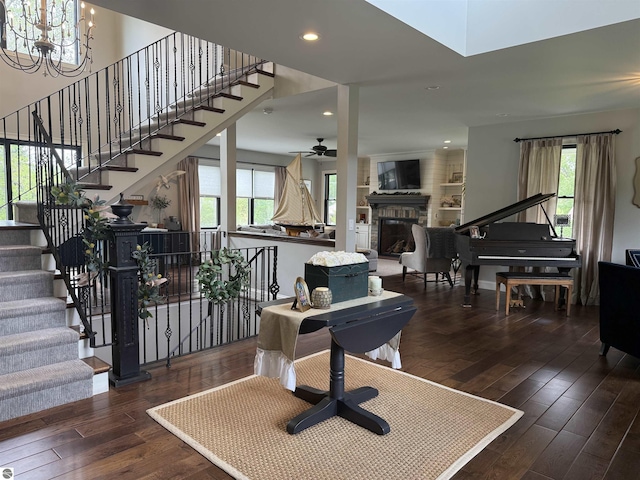 777 Stoneridge Dr, Mount Pleasant, MI 48858 - entrance foyer featuring a glass covered fireplace, hardwood / wood-style floors, a chandelier, stairway, and recessed lighting