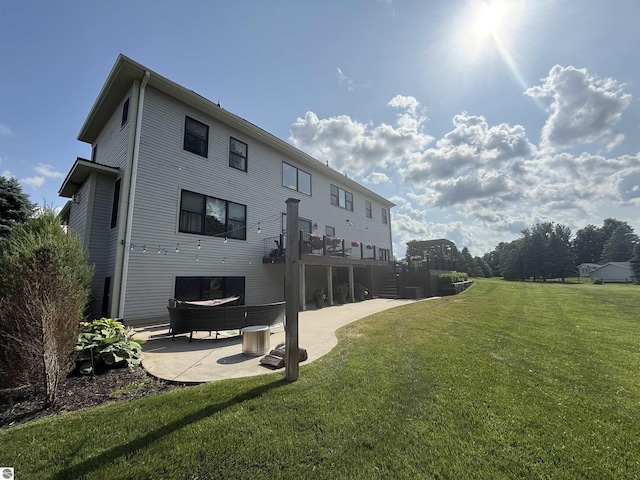 777 Stoneridge Dr, Mount Pleasant, MI 48858 - rear view of property with a patio area, a lawn, and stairs