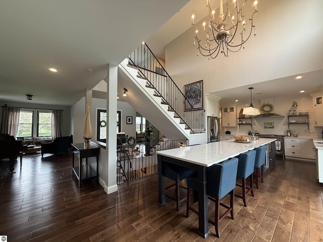 777 Stoneridge Dr, Mount Pleasant, MI 48858 - kitchen featuring stainless steel fridge with ice dispenser, dark wood finished floors, white cabinetry, and recessed lighting