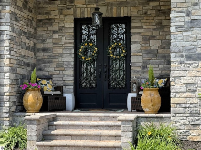 777 Stoneridge Dr, Mount Pleasant, MI 48858 - property entrance with french doors and stone siding