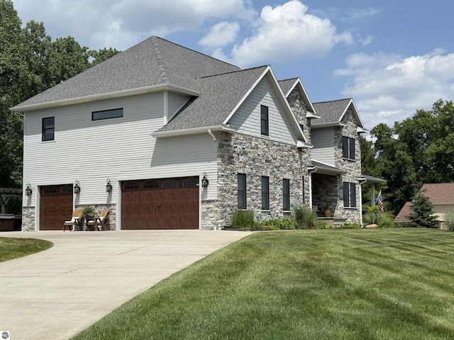 777 Stoneridge Dr, Mount Pleasant, MI 48858 - view of front facade with stone siding, a front yard, concrete driveway, and a garage