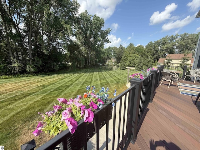 777 Stoneridge Dr, Mount Pleasant, MI 48858 - wooden terrace with a lawn