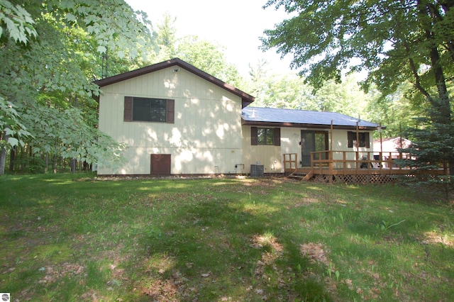 1294 Stoney Ridge Rd, West Branch, MI 48661 - rear view of property featuring a wooden deck and a lawn