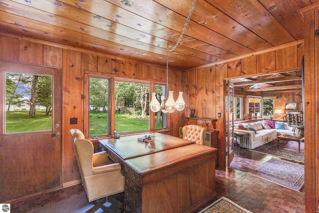 7822 W Welch Rd, Empire, MI 49630 - dining area with wood ceiling, wood walls, plenty of natural light, and ornamental molding