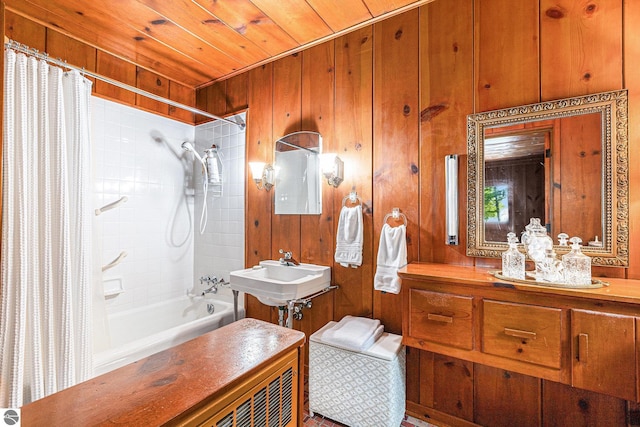 7822 W Welch Rd, Empire, MI 49630 - full bathroom with shower / bath combo, wood ceiling, and wooden walls