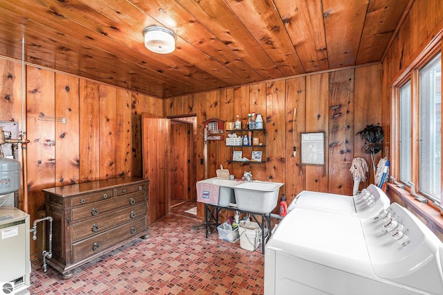 7822 W Welch Rd, Empire, MI 49630 - laundry room featuring wooden walls, independent washer and dryer, brick patterned flooring, and wooden ceiling
