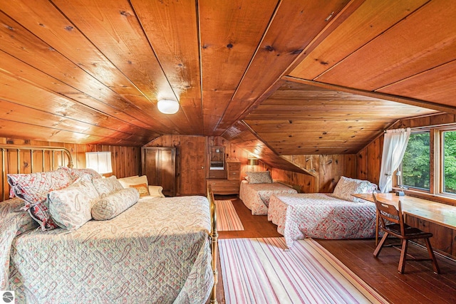 7822 W Welch Rd, Empire, MI 49630 - bedroom featuring vaulted ceiling, wooden ceiling, hardwood / wood-style flooring, and wood walls