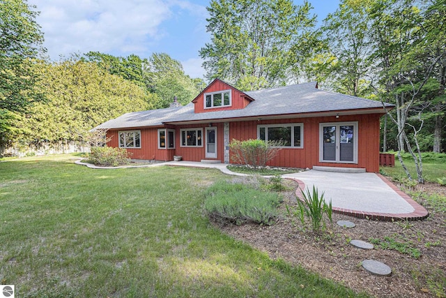 7822 W Welch Rd, Empire, MI 49630 - view of front of home featuring a front yard and french doors