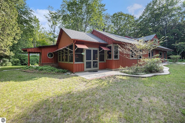 7822 W Welch Rd, Empire, MI 49630 - back of property featuring a lawn and roof with shingles