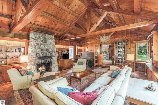 7822 W Welch Rd, Empire, MI 49630 - living area featuring wooden walls, wooden ceiling, and a fireplace