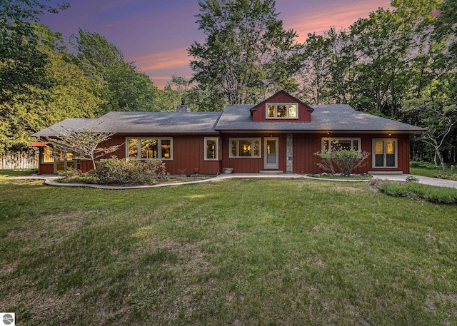 7822 W Welch Rd, Empire, MI 49630 - view of front of property featuring a front lawn, a porch, and a chimney