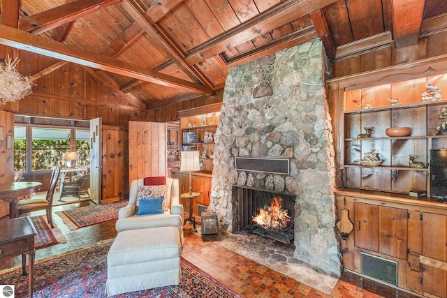 7822 W Welch Rd, Empire, MI 49630 - living room with wood ceiling, wooden walls, and a stone fireplace