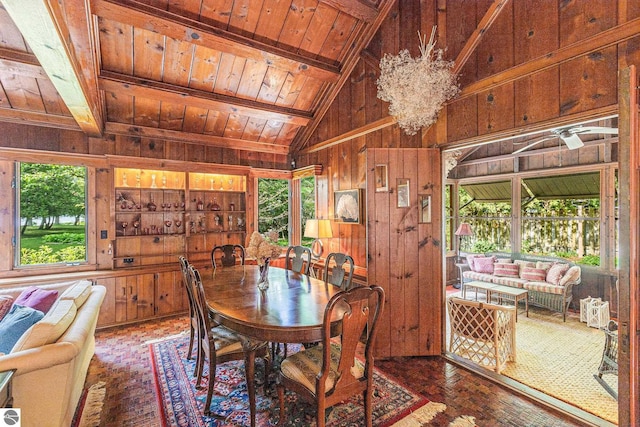 7822 W Welch Rd, Empire, MI 49630 - dining area featuring wooden walls, wood ceiling, hardwood / wood-style floors, and a chandelier