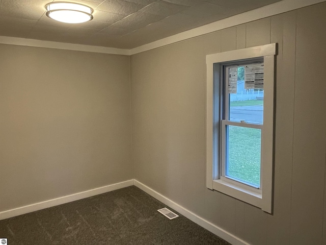 702 N Grafton Ave, Alma, MI 48801 - unfurnished room featuring dark colored carpet and baseboards