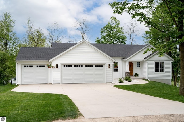 84 9 Mile Rd NW, Comstock Park, MI 49321 - view of front facade with driveway, a garage, board and batten siding, a front yard, and roof with shingles