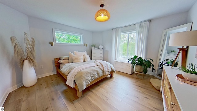 84 9 Mile Rd NW, Comstock Park, MI 49321 - bedroom with multiple windows and light wood-style flooring