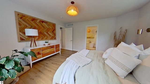 84 9 Mile Rd NW, Comstock Park, MI 49321 - bedroom featuring light wood-type flooring and ensuite bath