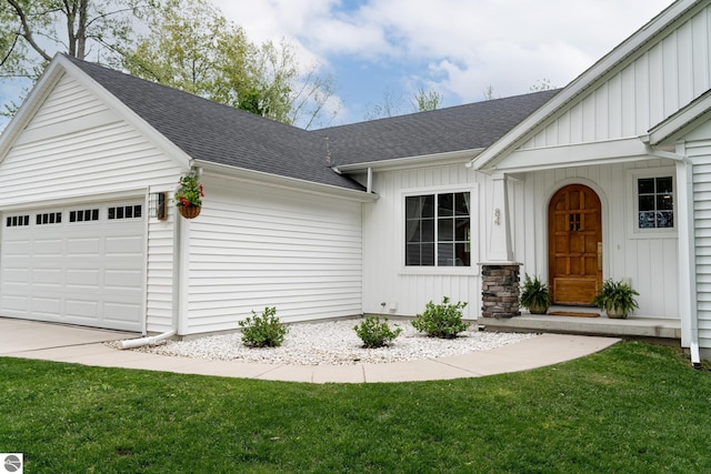 84 9 Mile Rd NW, Comstock Park, MI 49321 - doorway to property featuring a garage, a shingled roof, board and batten siding, and a lawn