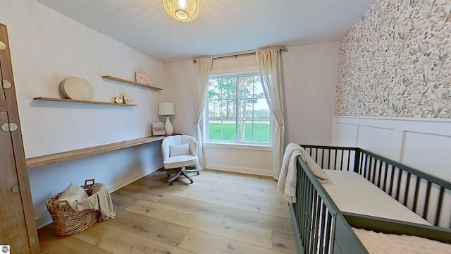 84 9 Mile Rd NW, Comstock Park, MI 49321 - bedroom featuring wood-type flooring and wainscoting