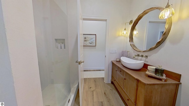 84 9 Mile Rd NW, Comstock Park, MI 49321 - bathroom featuring vanity, wood finished floors, and a shower