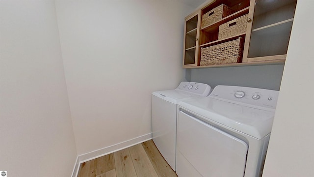 84 9 Mile Rd NW, Comstock Park, MI 49321 - laundry room with washer and clothes dryer and light wood-style floors