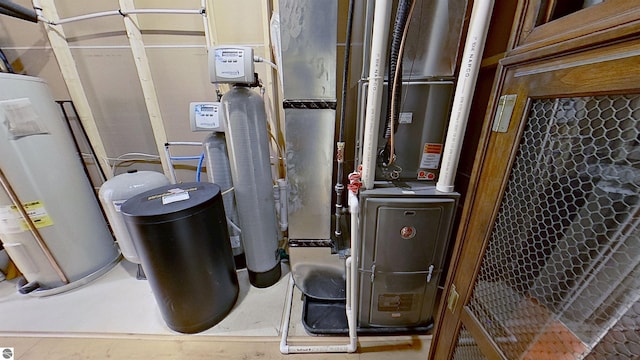 84 9 Mile Rd NW, Comstock Park, MI 49321 - utility room featuring water heater