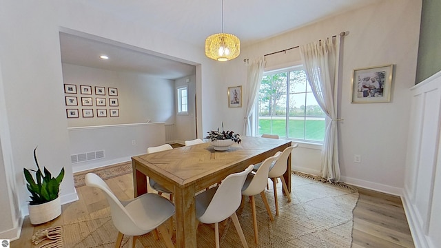 84 9 Mile Rd NW, Comstock Park, MI 49321 - dining room with healthy amount of natural light, light wood-type flooring, and a chandelier