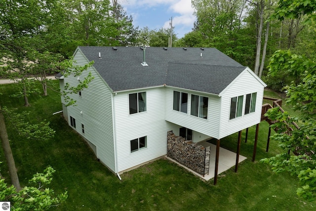 84 9 Mile Rd NW, Comstock Park, MI 49321 - rear view of property with a patio, roof with shingles, a lawn, and a wooden deck