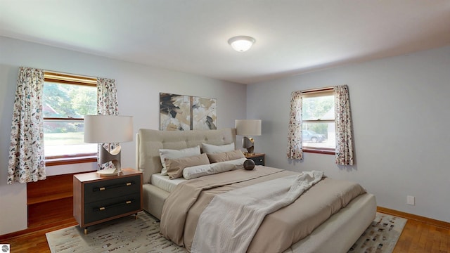1519 Ridge Rdg, Mount Pleasant, MI 48858 - bedroom with light wood-style floors and baseboards