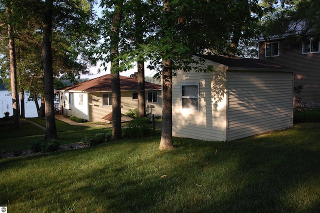 4038 Ogemaw Shores Dr, West Branch, MI 48661 - rear view of house with a lawn