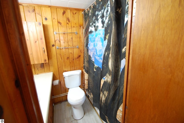 4038 Ogemaw Shores Dr, West Branch, MI 48661 - full bath featuring wooden walls and a shower with shower curtain