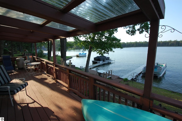 4038 Ogemaw Shores Dr, West Branch, MI 48661 - wooden terrace featuring a water view, a boat dock, and boat lift