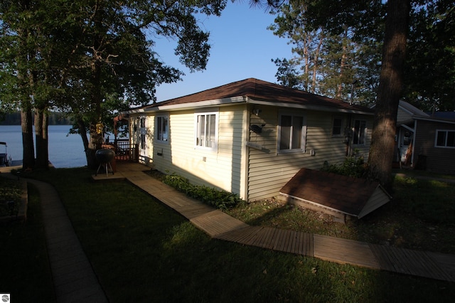 4038 Ogemaw Shores Dr, West Branch, MI 48661 - view of property exterior featuring a water view