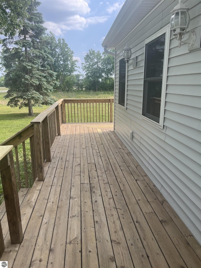 2507 N Lincoln Rd, Rosebush, MI 48878 - wooden terrace featuring a lawn