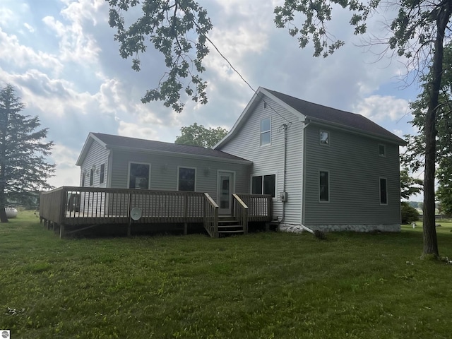 2507 N Lincoln Rd, Rosebush, MI 48878 - rear view of house with a lawn and a wooden deck
