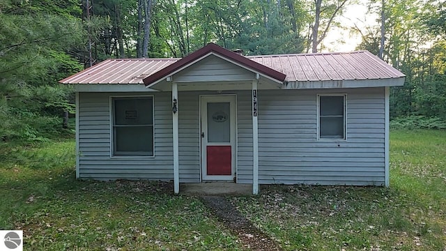 1947 NE Anita Rd, Kalkaska, MI 49646 - bungalow featuring a metal roof