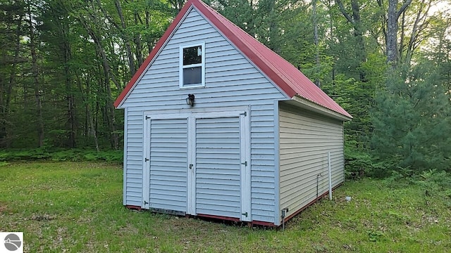 1947 NE Anita Rd, Kalkaska, MI 49646 - view of shed featuring a view of trees