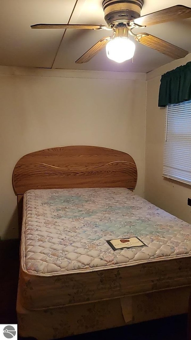 1947 NE Anita Rd, Kalkaska, MI 49646 - bedroom featuring a ceiling fan