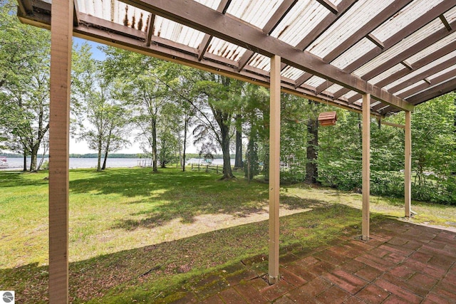 7786 N Shore Ct, Grawn, MI 49637 - view of grassy yard with a water view and a patio