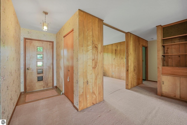 7786 N Shore Ct, Grawn, MI 49637 - foyer with carpet floors and wooden walls