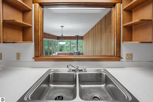 7786 N Shore Ct, Grawn, MI 49637 - kitchen with open shelves, light countertops, and brown cabinets