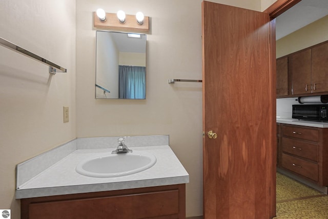 7786 N Shore Ct, Grawn, MI 49637 - bathroom featuring vanity